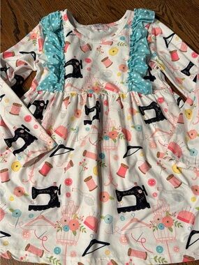 Pete + Lucy Girls Sewing Theme Long Sleeve Dress in White with Aqua Ruffle 7/8